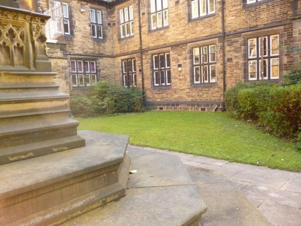 An inviting view of the elegant stone facade of...