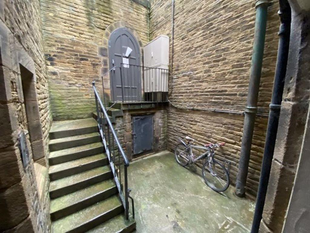 A well-maintained stone staircase and landing a...