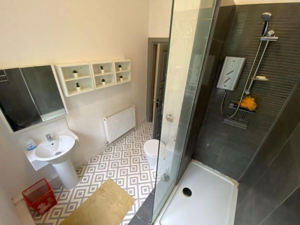 Modern bathroom with a spacious shower area, wh...