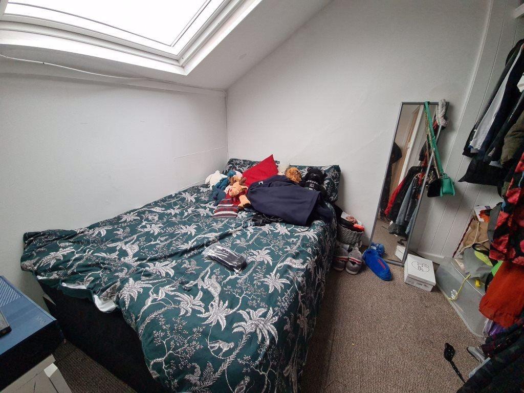 Cozy attic double bedroom with a large skylight...