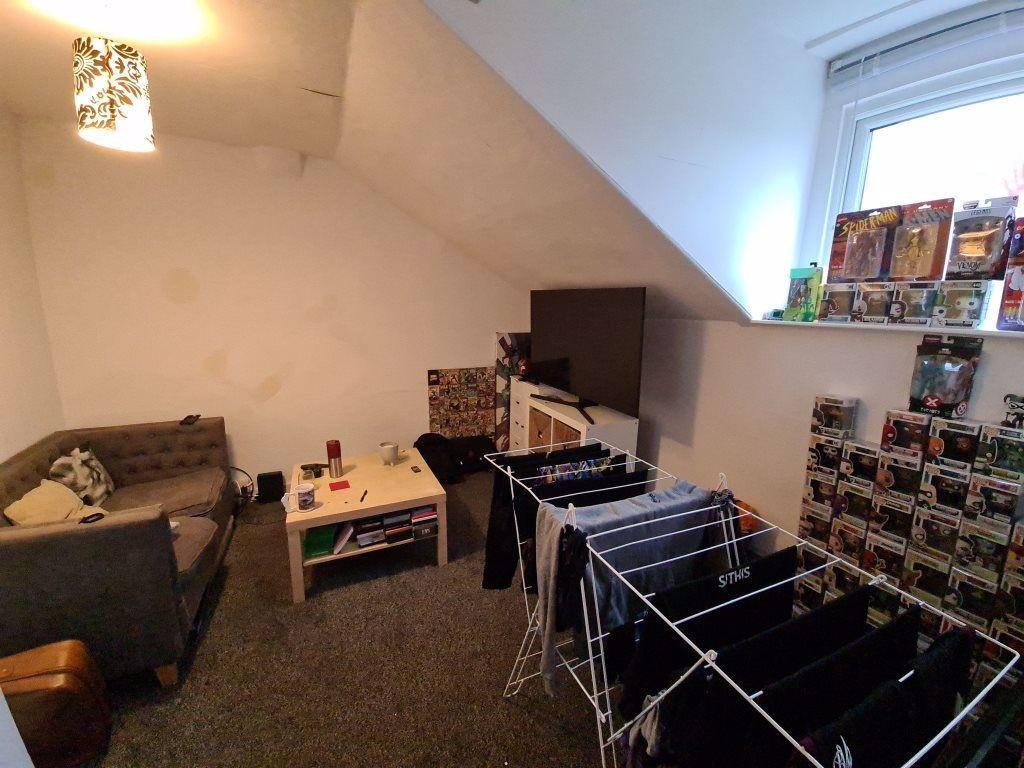 Cozy attic double bedroom with sloped ceilings,...