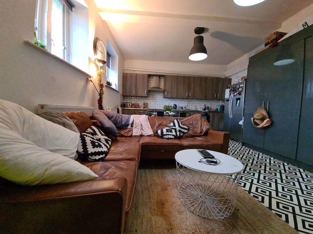 A cozy and modern living room featuring a large...