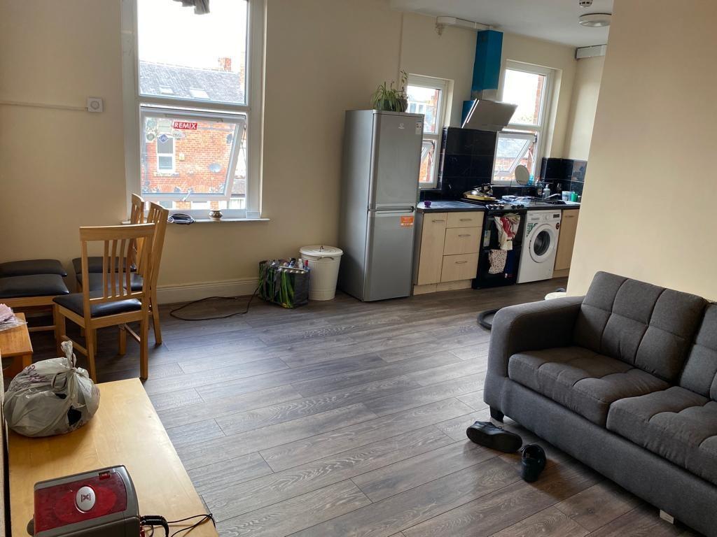 A spacious living area featuring large windows ...