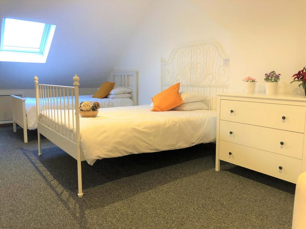 Bright and tidy double bedroom featuring two wh...