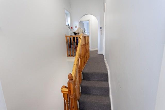 Bright hallway with wooden balustrade...