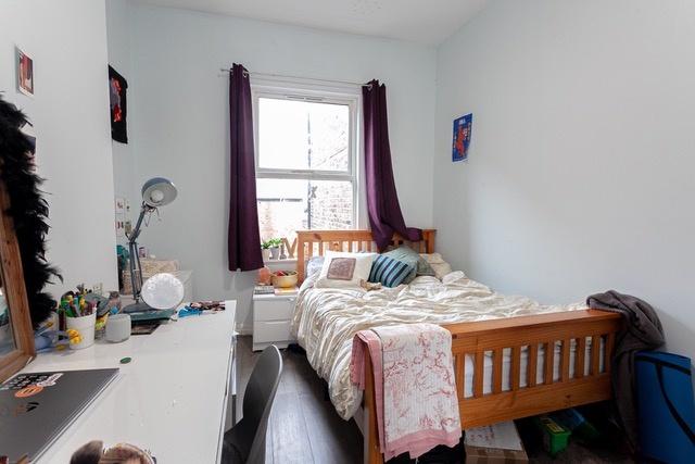 Bright bedroom with study space and comfy bed...