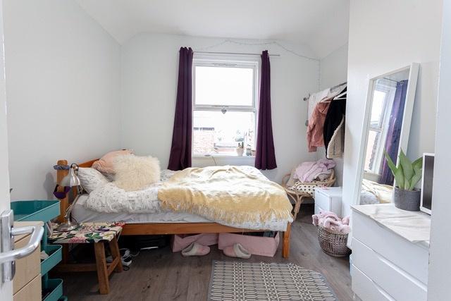 Bright bedroom with comfy double bed and storag...
