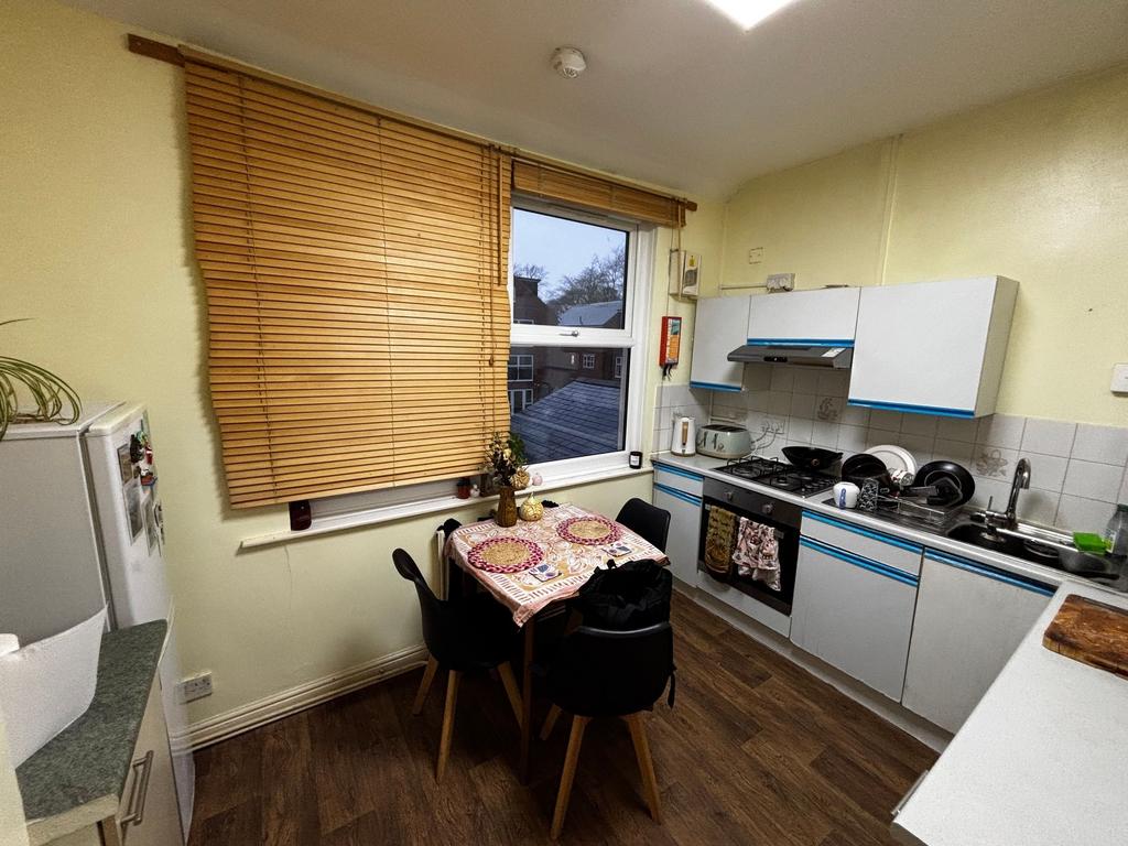 Bright, functional kitchen with integrated appl...