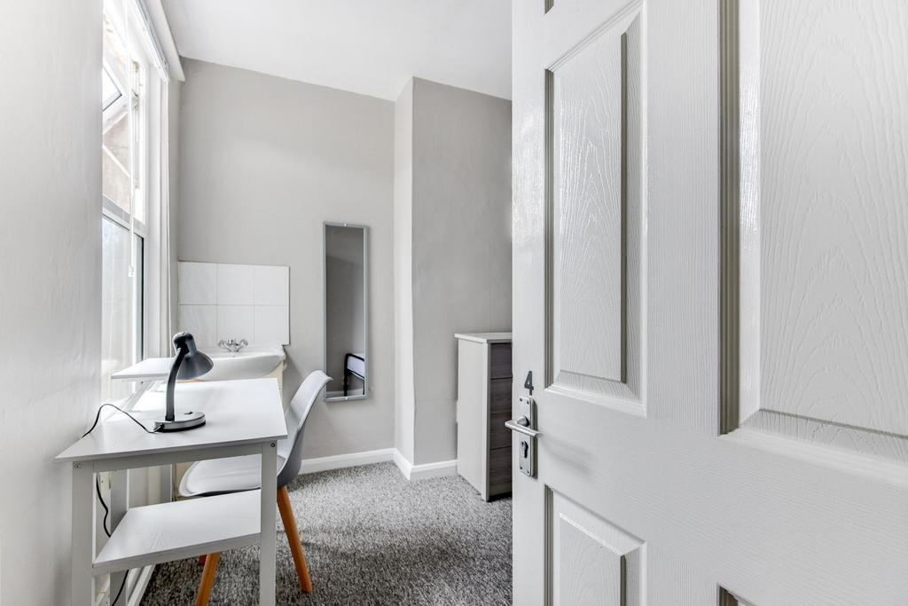 A clean and well-maintained bathroom featuring ...