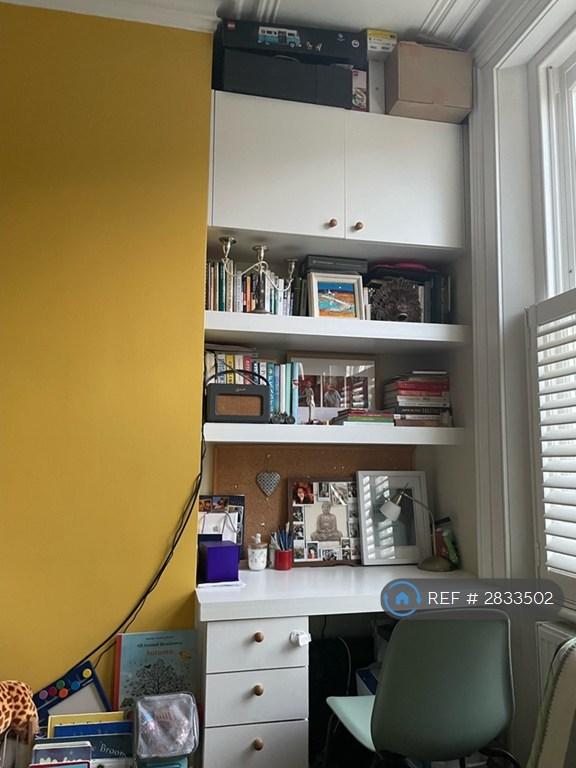 Living Room With Built-In Desk And Storage