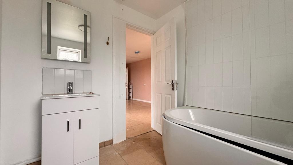 Bright modern bathroom with freestanding bath...