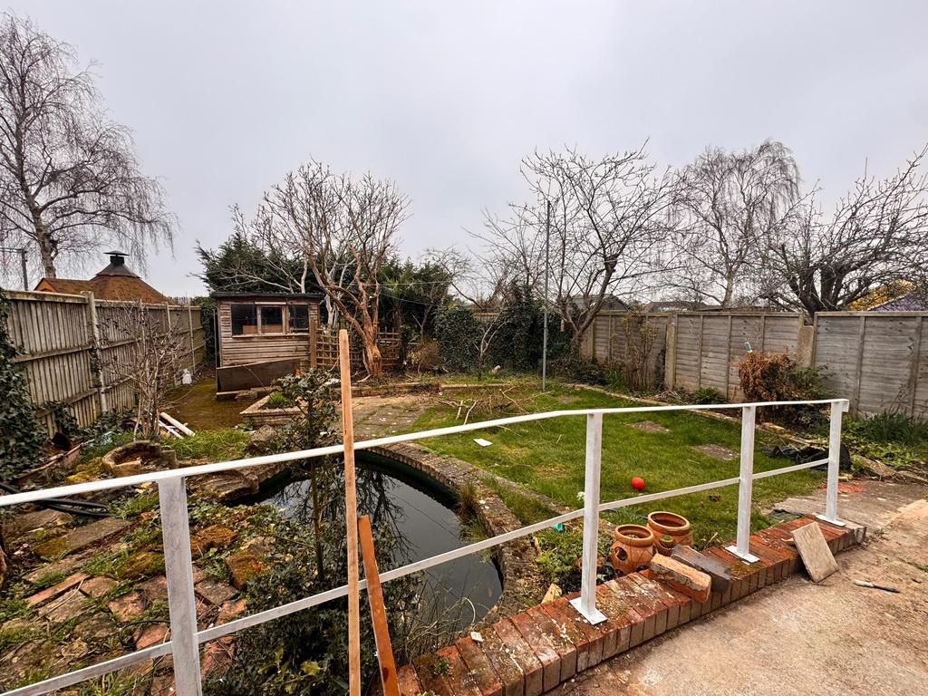 Private rear garden with pond and patio area...