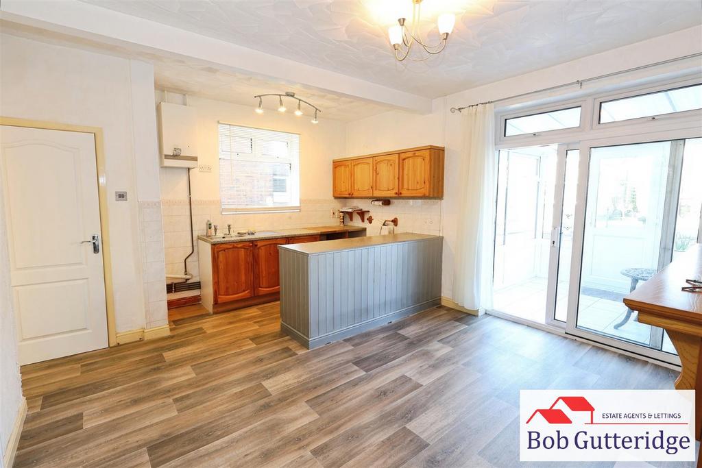Open plan fitted kitchen / dining room
