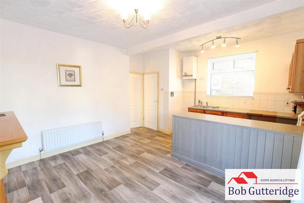 Open plan fitted kitchen / dining room