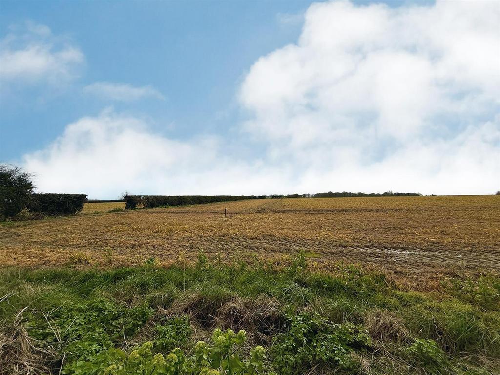 Farmland to the rear