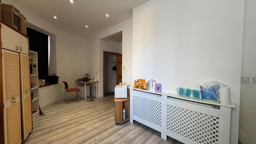 Bright, modern kitchenette with storage and din...