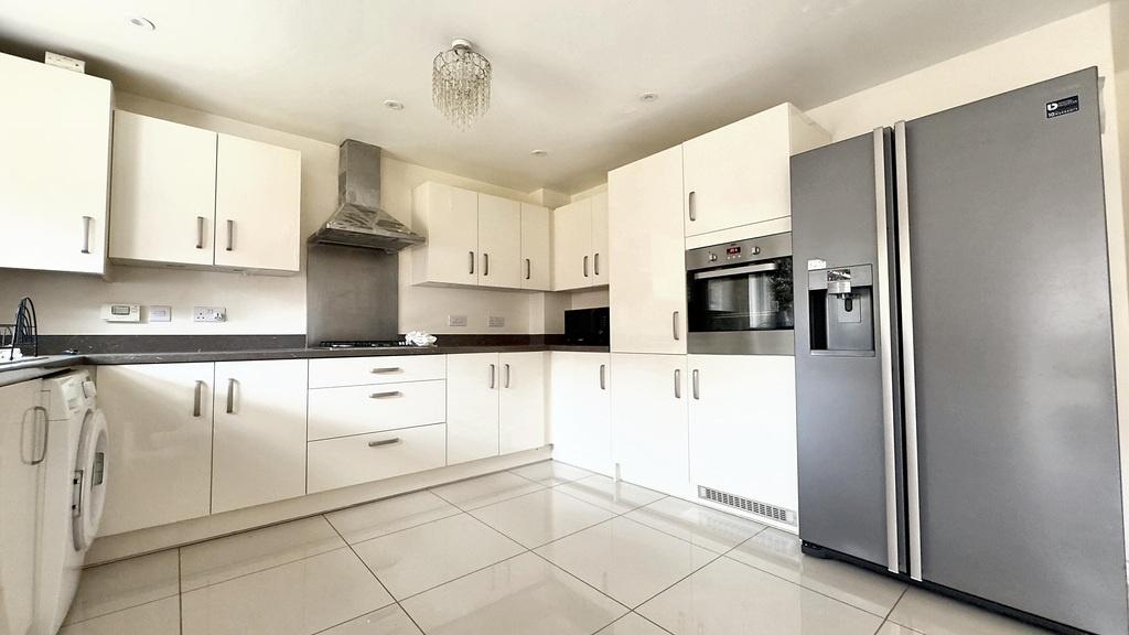 Bright modern kitchen with sleek appliances...