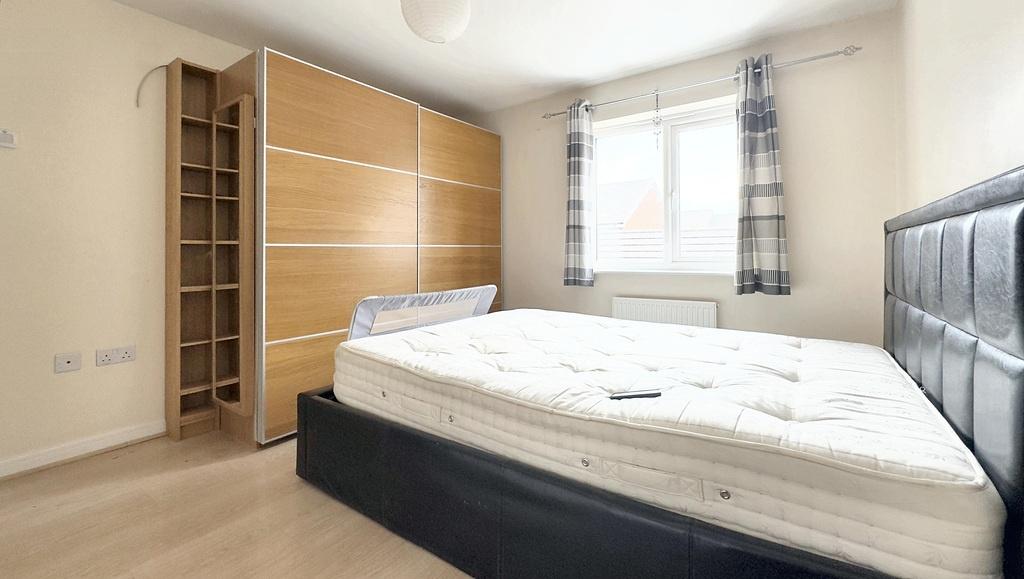 Bright double bedroom with large wardrobe...