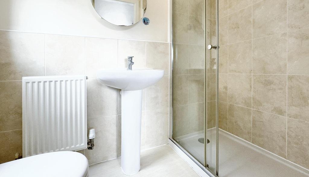 Modern tiled bathroom with walk-in shower...