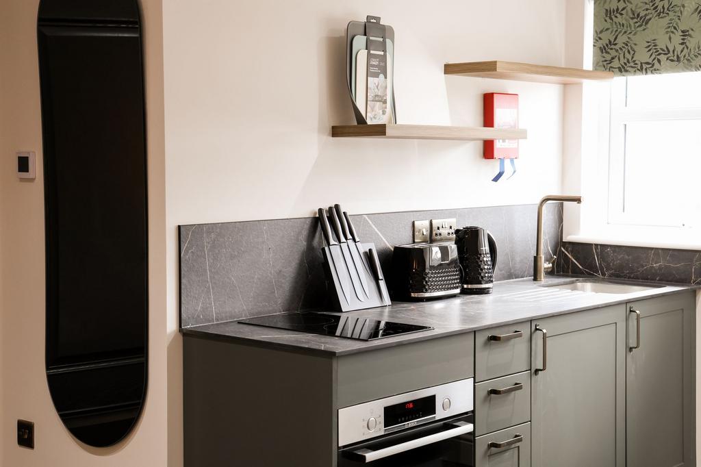 Modern compact kitchen with sleek appliances...