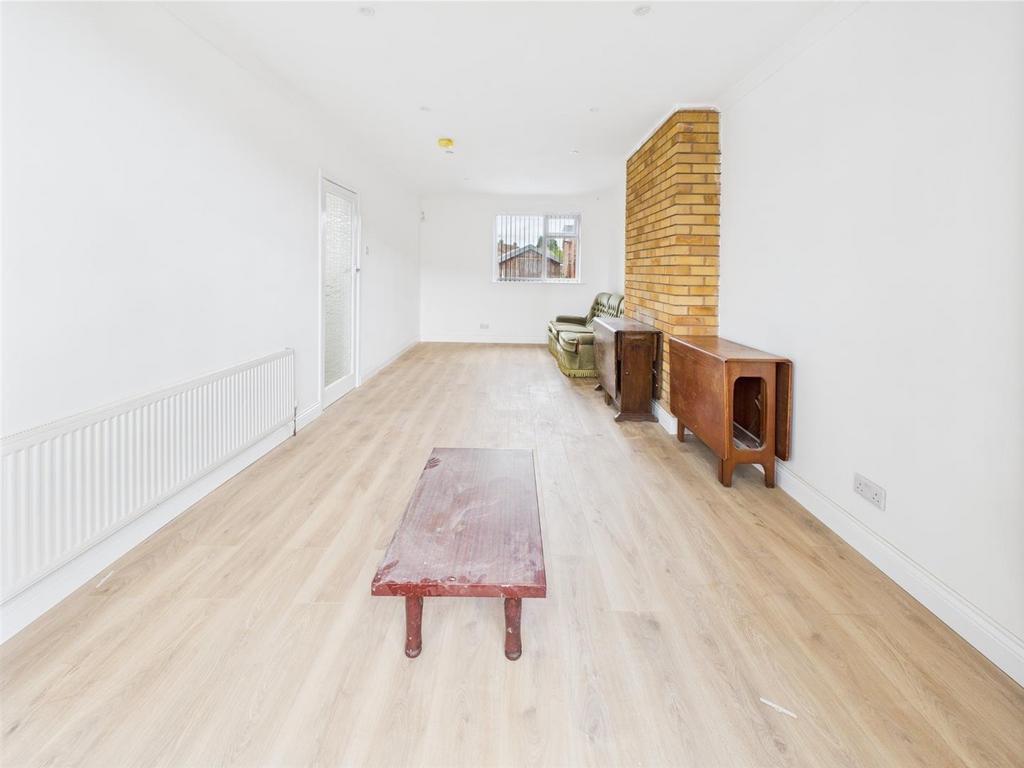 Bright long living room with wooden floor...
