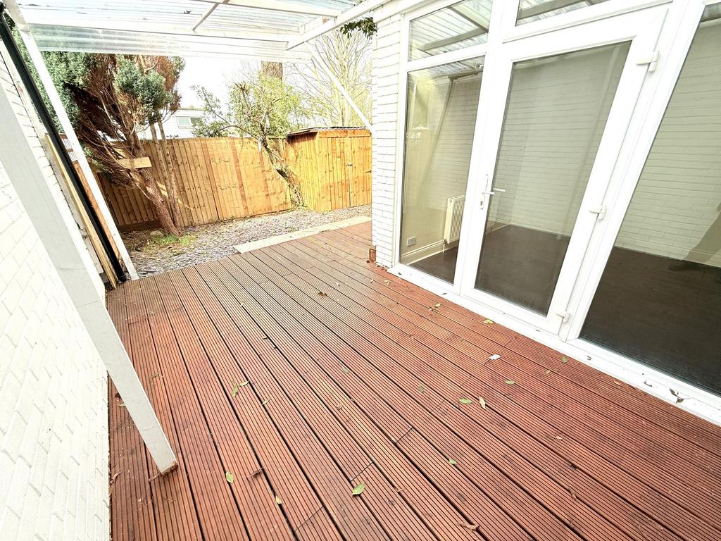 Conservatory interior, french doors leading to garden