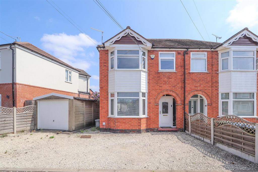 Semi‑detached house with driveway and garage...