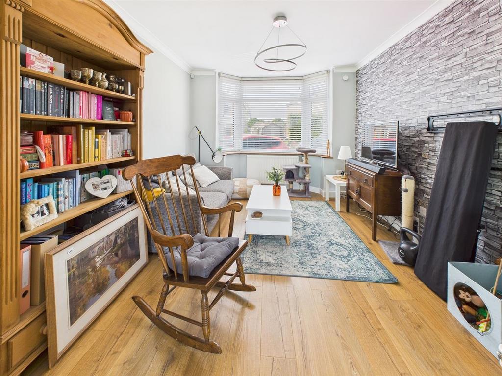 Bright, cosy living room with large bay window...