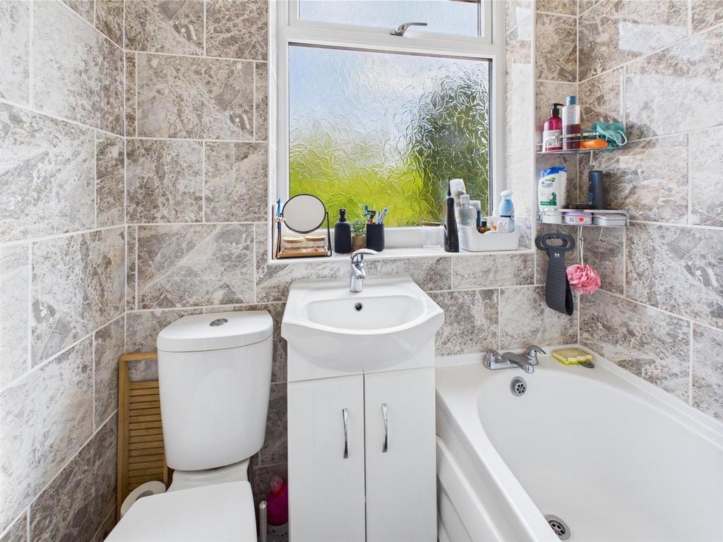 Bright modern bathroom with bath and sink...