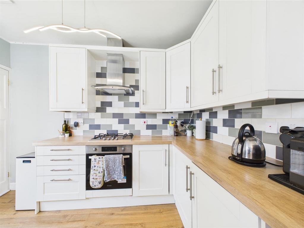 Bright modern kitchen with wood worktops...