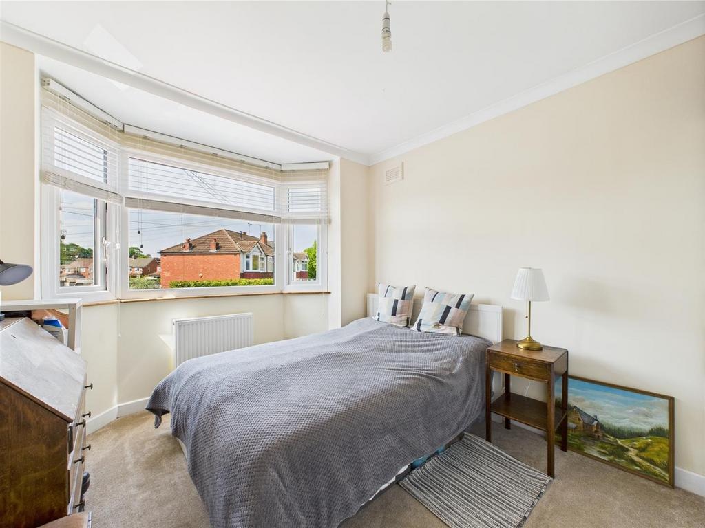 Bright double bedroom with bay window...