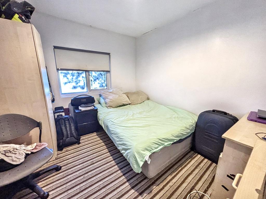 Cozy double bedroom with window and storage...