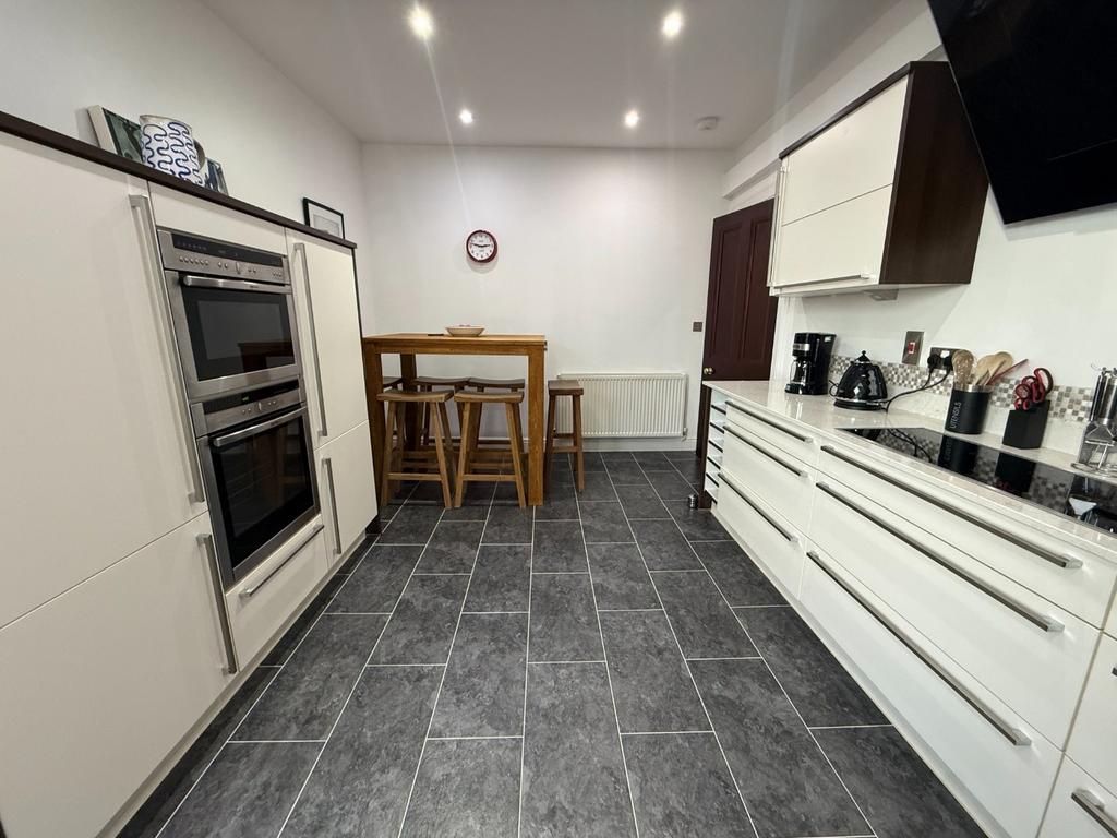 Modern fitted kitchen with breakfast bar...
