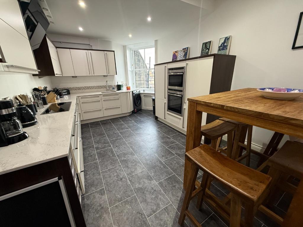 Modern kitchen with dining bar and appliances...