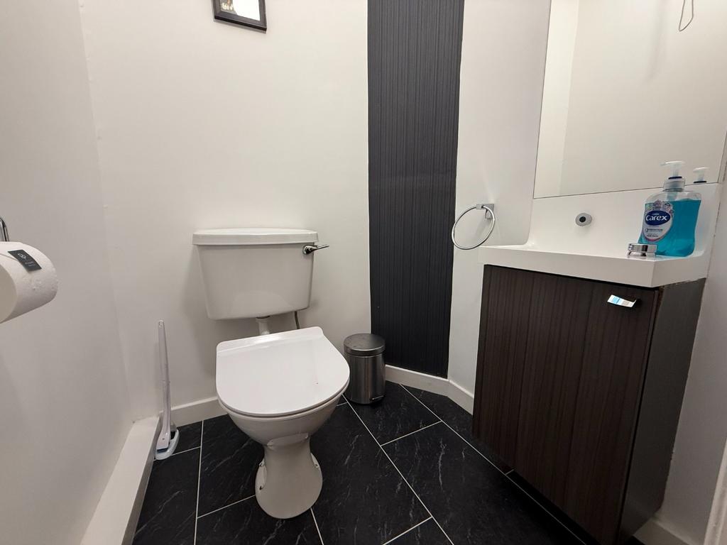 Neat modern bathroom with vanity and toilet...