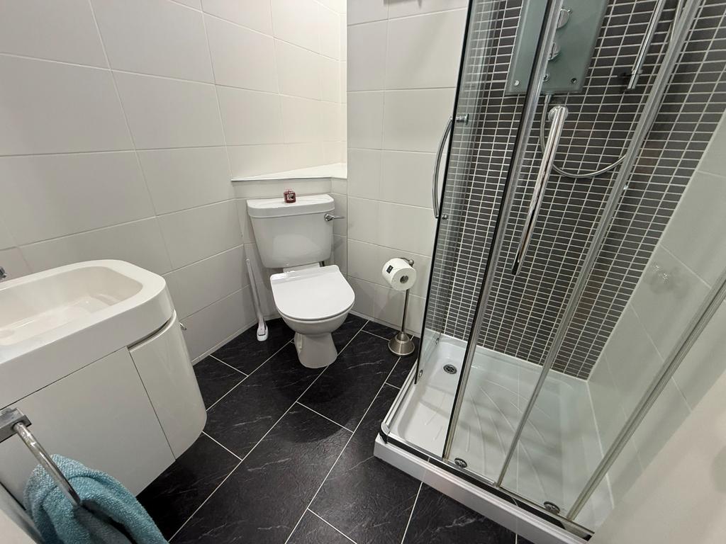 Modern bathroom with shower and clean finishes...