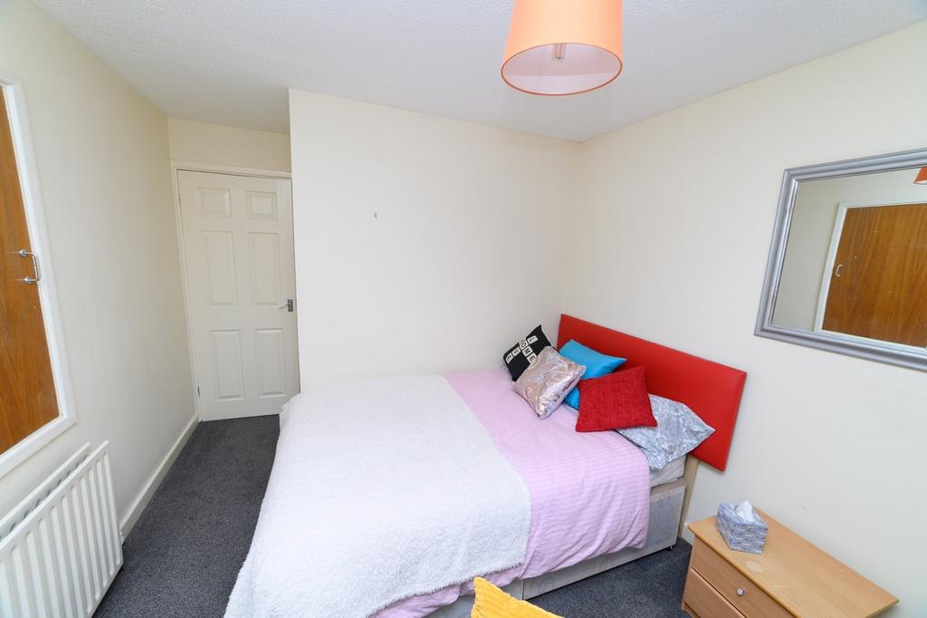 Bright, neatly presented bedroom with a double ...