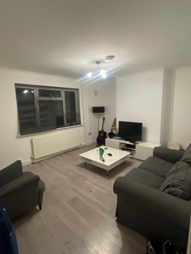Bright, neutral living room with modern light w...