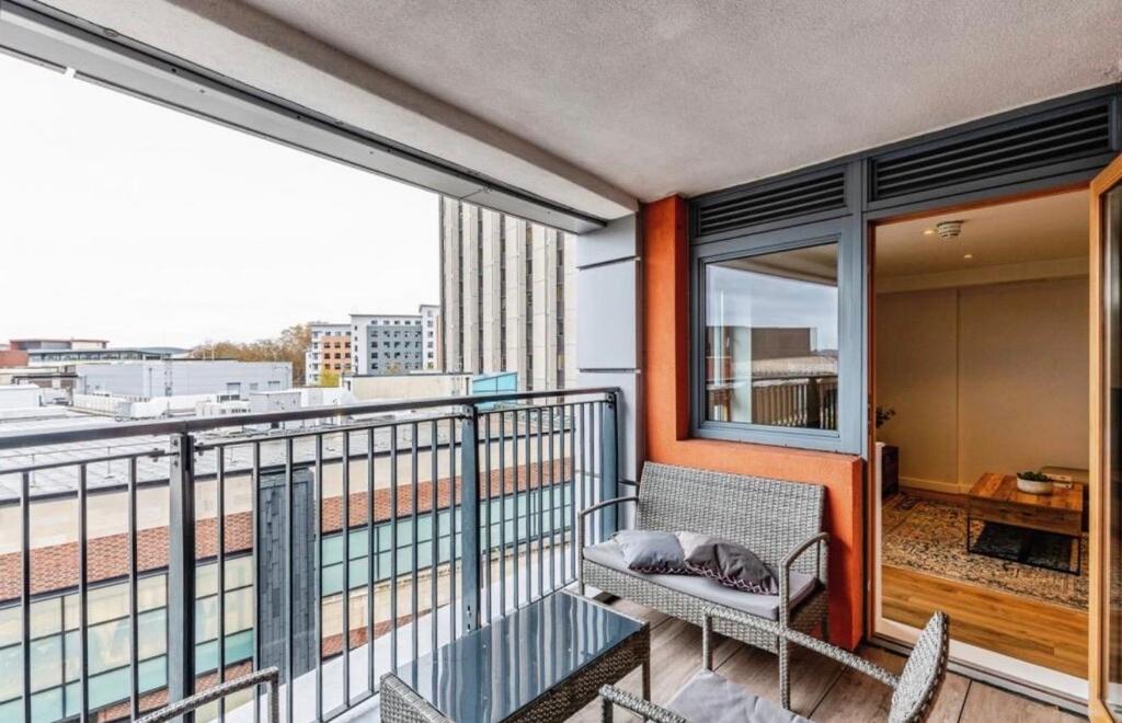 Covered city-center balcony with woven outdoor ...