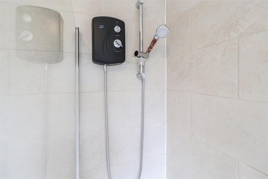 Modern tiled shower with electric unit...