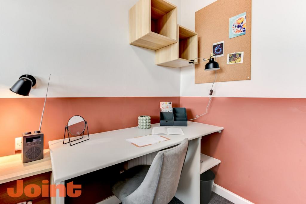 Bright, neatly styled study corner with a large...