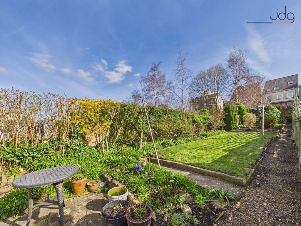 Long, private garden with patio and mature...