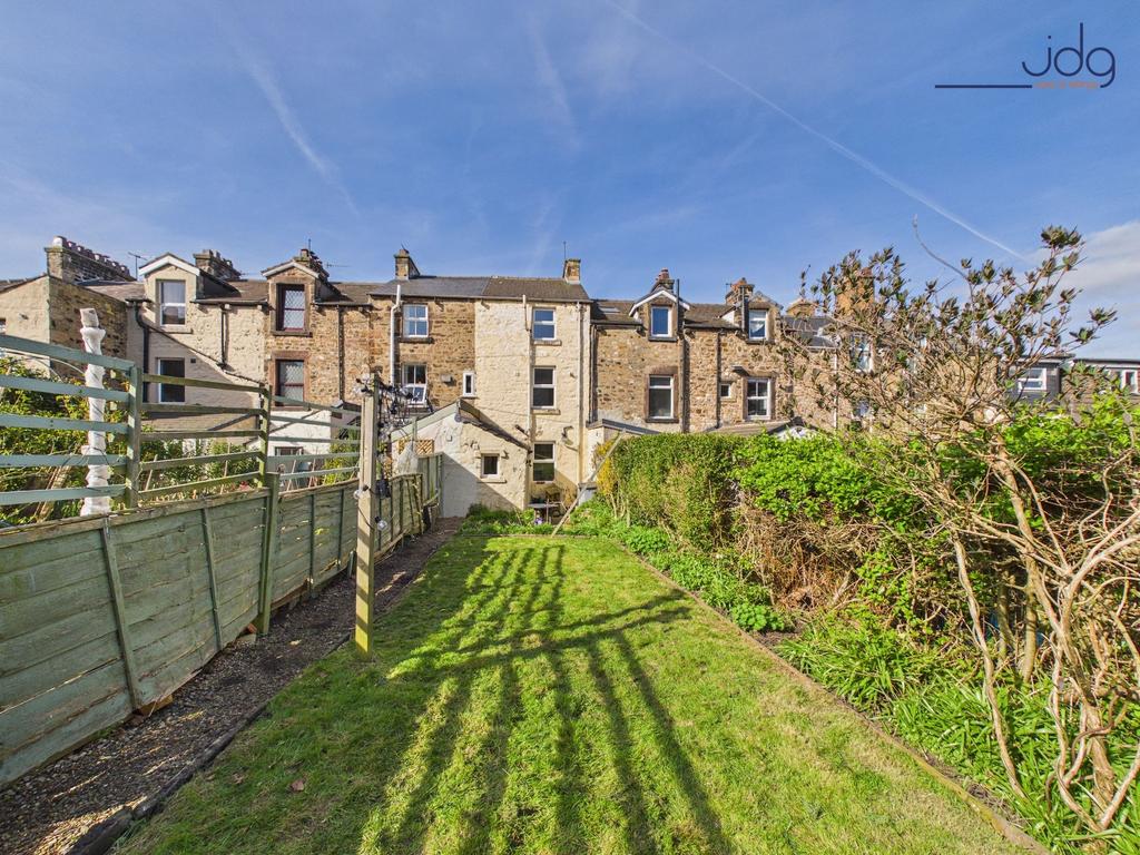 Long, private garden with patio and mature...