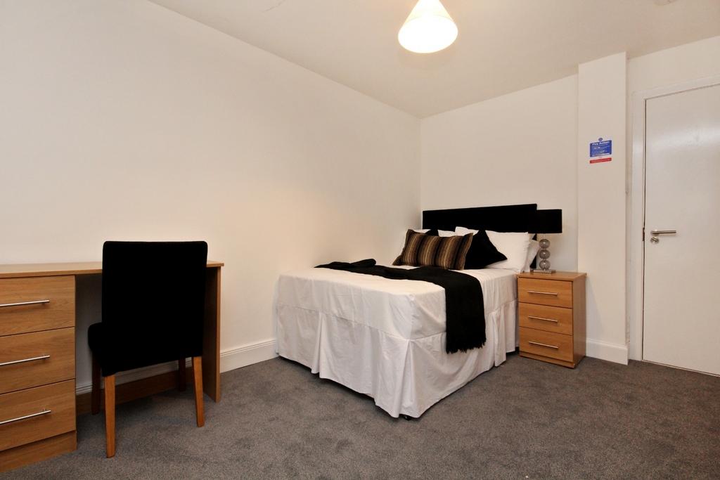 Neat double bedroom with simple modern decor...