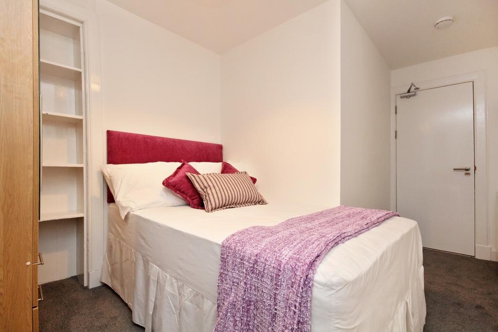 Cozy bedroom with comfy bed and soft accents...