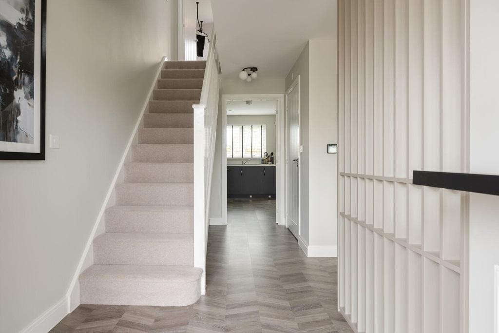 The entrance hall is flooded with natural light...