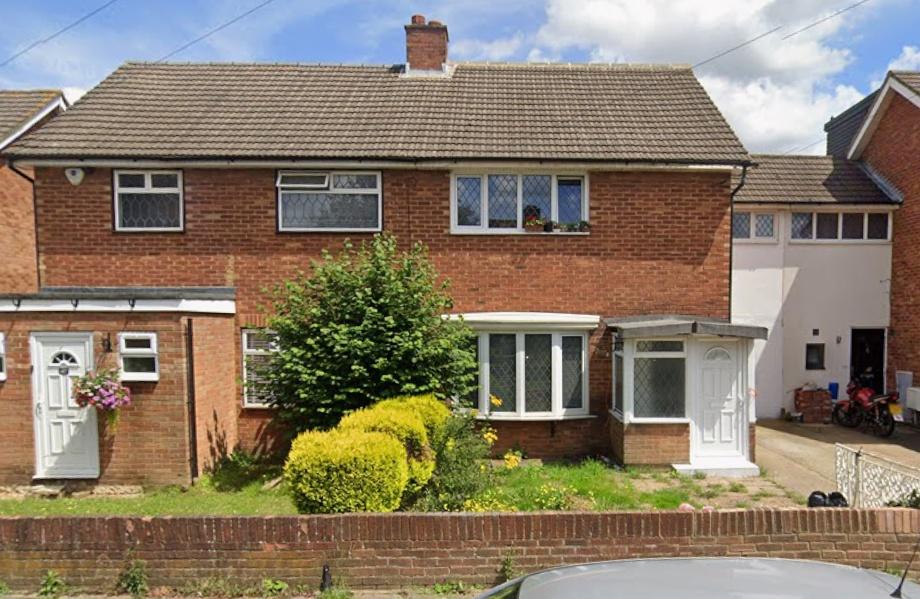 Redbrick semi with front garden and bay window...