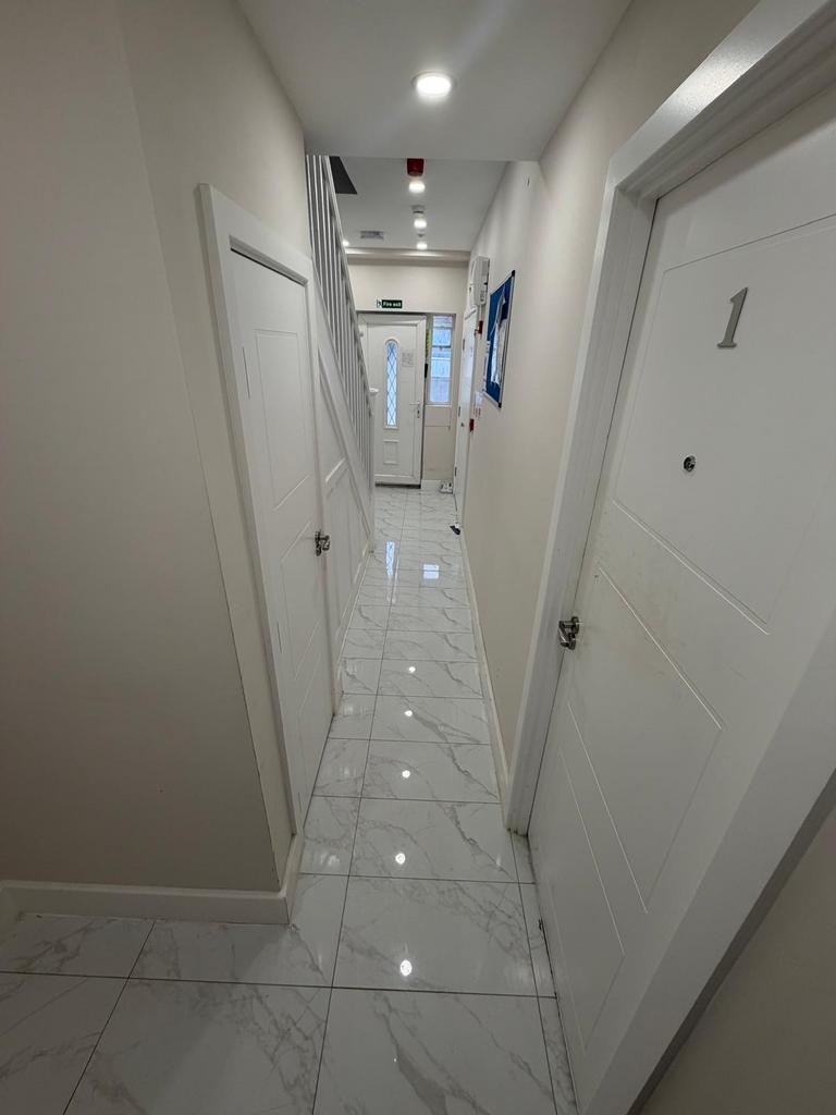 Bright hallway with polished marble floor tiles...