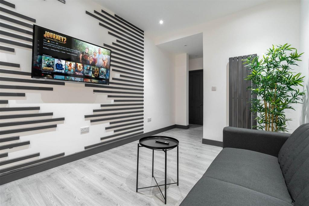 Contemporary lounge with TV feature wall...