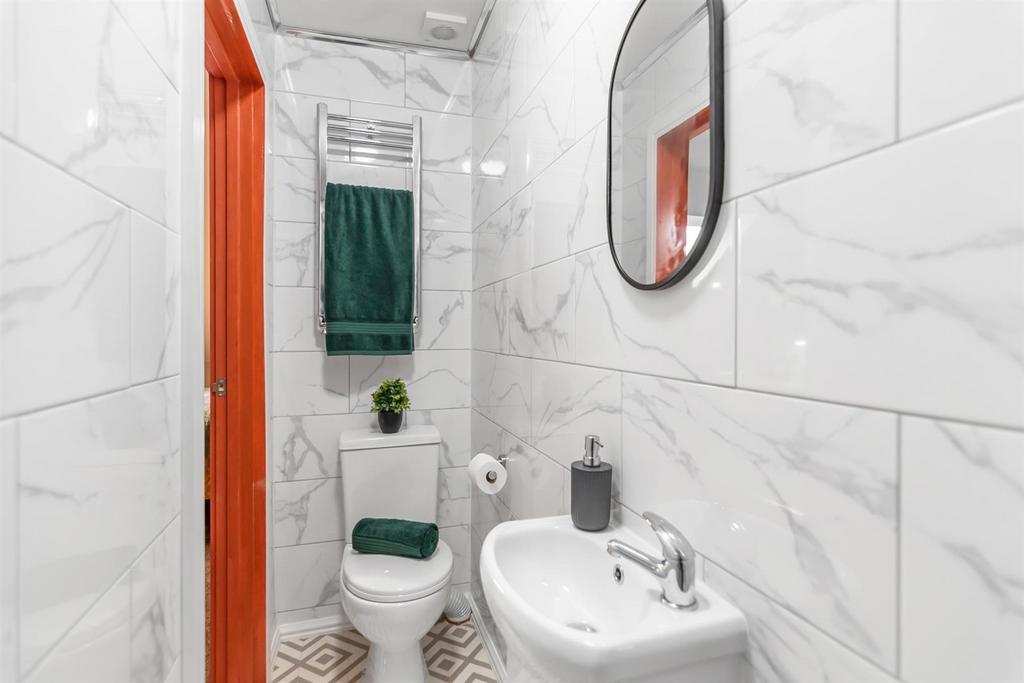 Bright, modern bathroom with marble tiles...